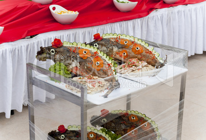 Celebratory food: stuffed fish on served table