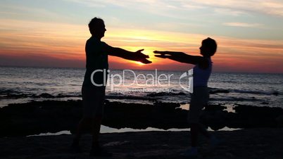 Man and a woman by the sea