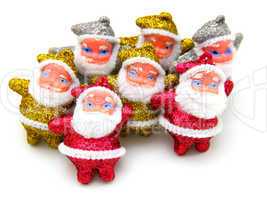 Some dolls of Santa Claus are together