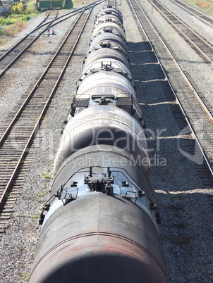 The train transports oil in tanks .