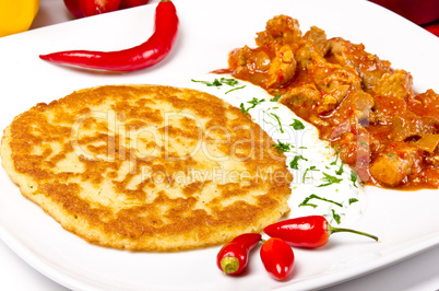 hungarian goulash with potato pancakes