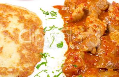 hungarian goulash with potato pancakes