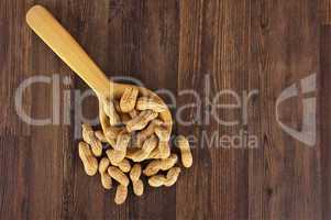 Peanuts in a wooden spoon