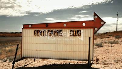 Gentlemens Club Sign in Desert
