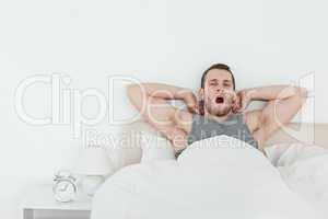 Man yawning while waking up
