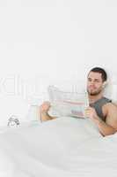 Portrait of a quiet man reading a newspaper
