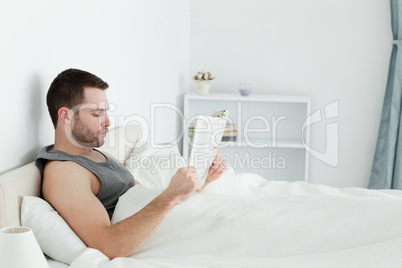 Calm man reading a newspaper