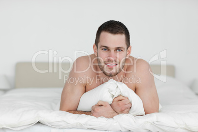 Man lying on his bed