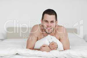 Man lying on his bed