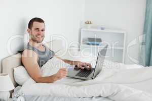 Smiling man purchasing online