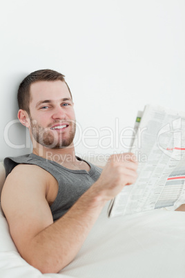 Portrait of a handsome man reading a newspaper