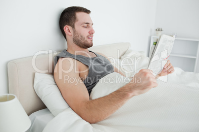 Beautiful man reading a newspaper