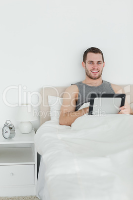 Portrait of a handsome man using a tablet computer