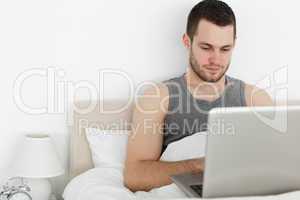 Attractive man using a laptop