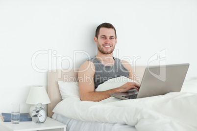 Serene man using a laptop