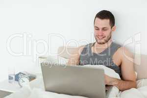 Peaceful man using a laptop