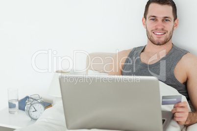 Handsome man shopping online