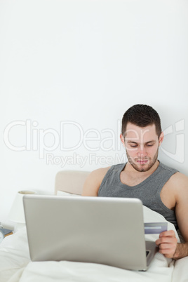 Portrait of a young man shopping online