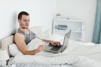 Young man purchasing online