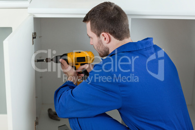 Handyman fixing a door