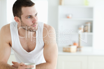 Young man having breakfast