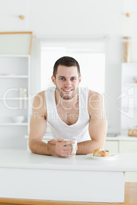 Portrait of a happy man having breakfast