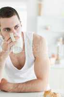 Portrait of a young man having coffee