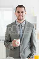 Portrait of a businessman having breakfast