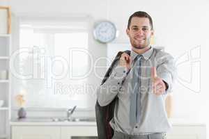 Businessman posing with the thumb up