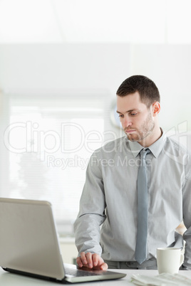 Portrait of a businessman using a laptop