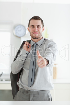 Portrait of a businessman with the thumb up