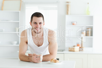 Happy man having breakfast