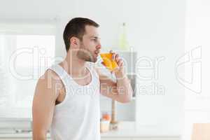 Quiet man drinking orange juice