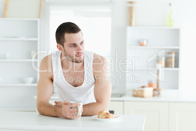 Handsome man having breakfast