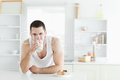 Attractive man having breakfast