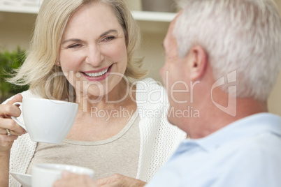 Happy Senior Man & Woman Couple Drinking Tea or Coffee