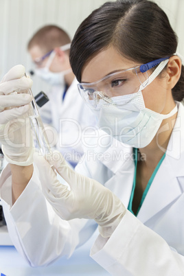 Chinese Female Woman Scientist With Test Tube In Laboratory