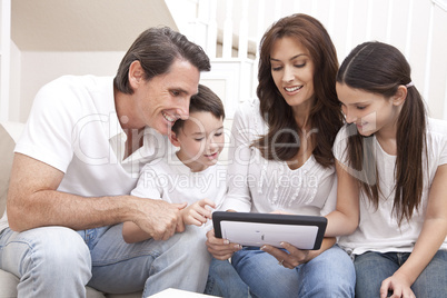 Happy Family Having Fun Using Tablet Computer At Home