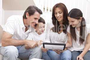 Happy Family Having Fun Using Tablet Computer At Home