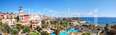 Panorama of luxury hotel and Playa de las Americas at background