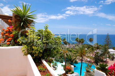 View from balcony on recreation area with swimming pools and bea