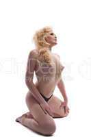 Nude woman posing isolated