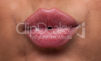 Beauty woman lips blow close-up