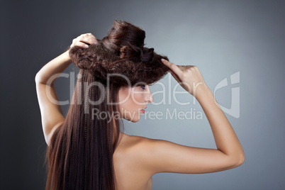 Cute naked woman posing with hair style hat