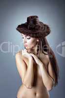 Bare woman with hair style close breast confused