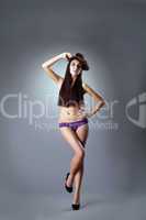 woman with long hairs stand in purple panties