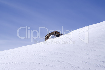 The old brick house in middle of ski slope