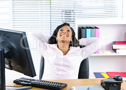 Black businesswoman resting at desk