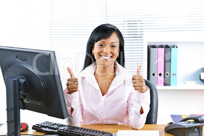 Businesswoman giving thumbs up