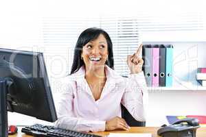 Businesswoman having idea at desk